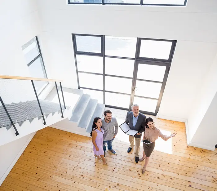 Real estate agents showcasing a property